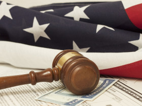 Gavel on Social Security ID ad immigration documents